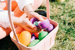 Child Finding a Piece of Candy in Her Easter Egg  image 2