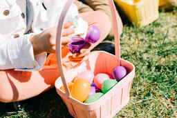 Child Finding a Piece of Candy in Her Easter Egg  image 4