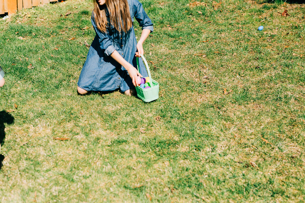 Girl Putting Eggs in Her Easter Basket large preview