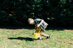 Boy Running in an Easter Egg hunt  image 4