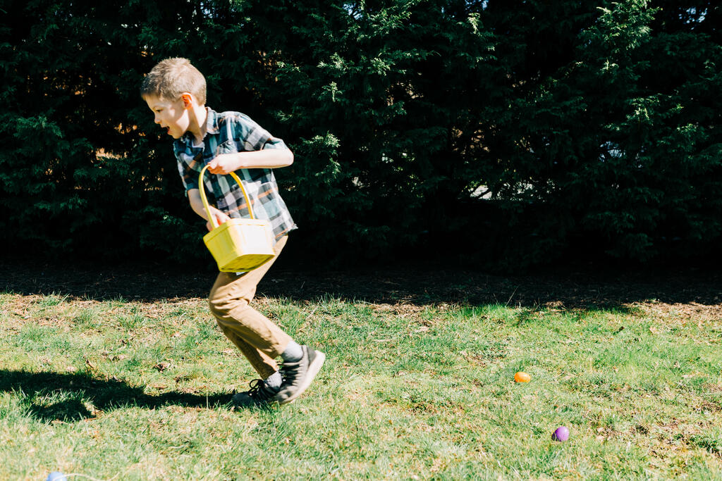 Boy Running in an Easter Egg hunt large preview