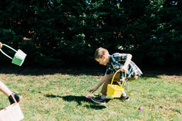 Boy Running in an Easter Egg hunt  image 3