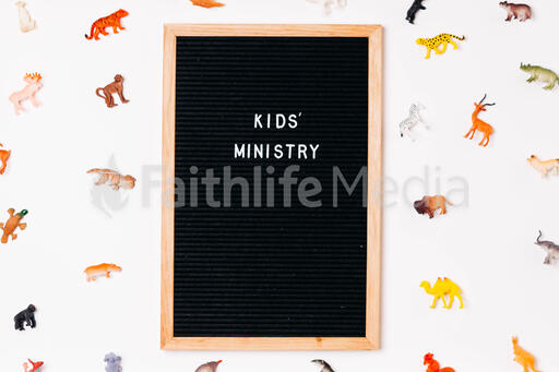 Kids' Ministry Letter Board Surrounded by Toy Animals