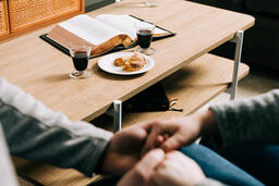Couple Praying Together Before Communion at Home  image 2