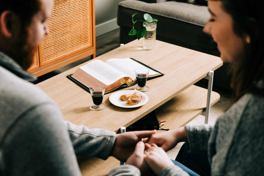Couple Praying Together Before Communion at Home large preview