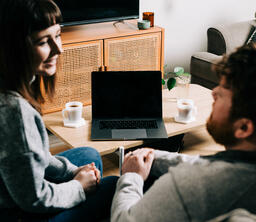 Couple Talking During Church at Home on a Laptop  image 1