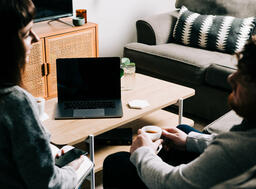 Couple Watching Church at Home on a Laptop  image 4