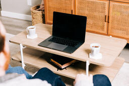 Laptop and Mugs on a Coffee Table  image 3