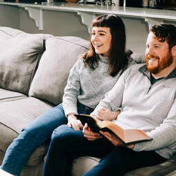 Couple Watching Church at Home with a Bible  image 1