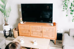 Couple Watching Church at Home on a TV  image 2