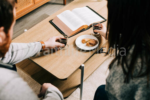 Couple Taking Communion Together at Home