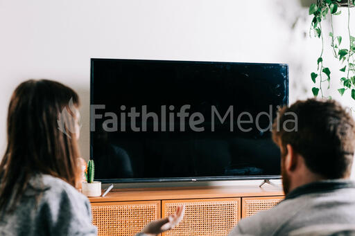 Couple Worshipping Together During Church at Home