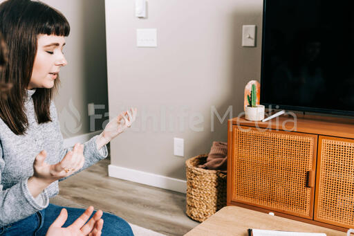 Woman Praying and Worshipping at Home