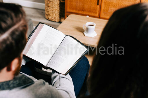 Couple Reading the Bible Together at Home