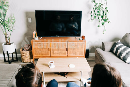 Couple Watching Church at Home on a TV