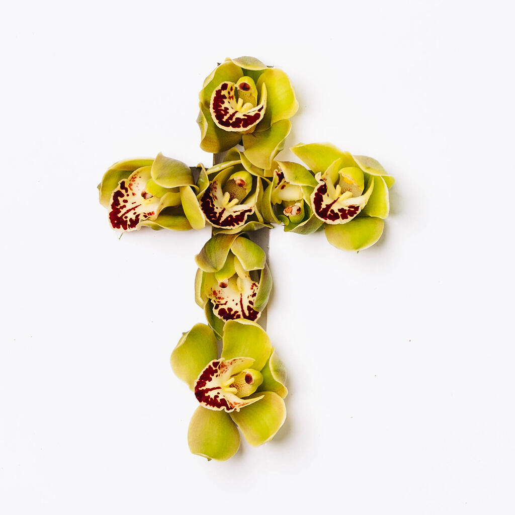 Cross with Green Flowers Poking Through large preview