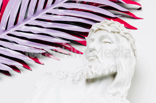 Christ Statue and Palm Leaves