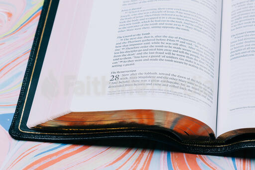 Bible Open to Matthew 28 on Pastel Marbled Background
