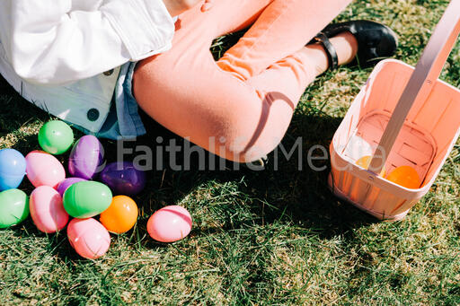Child Looking Through Their Easter Eggs