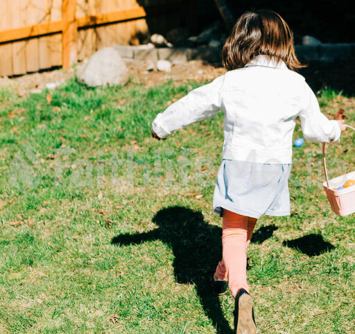 Girl Running in an Easter Egg Hunt