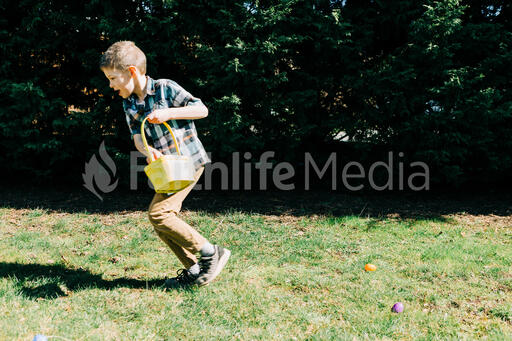 Boy Running in an Easter Egg hunt