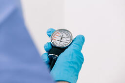 Doctor Holding a Blood Pressure Gauge  image 2
