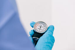 Doctor Holding a Blood Pressure Gauge  image 1