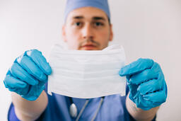 Doctor Holding a Mask Out  image 2