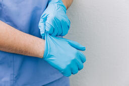 Doctor Putting Medical Gloves On  image 2