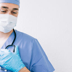 Doctor Looking Down with a Medical Mask On  image 5