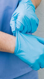 Doctor Putting Medical Gloves On  image 1