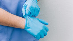 Doctor Putting Medical Gloves On  image 3