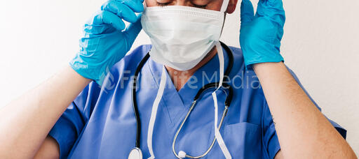 Doctor Putting on a Medical Mask