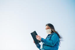Woman Wearing a Face Mask and Reading the Bible  image 5