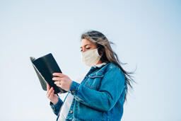 Woman Wearing a Face Mask and Reading the Bible  image 6