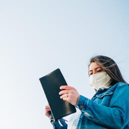 Woman Wearing a Face Mask and Reading the Bible  image 4