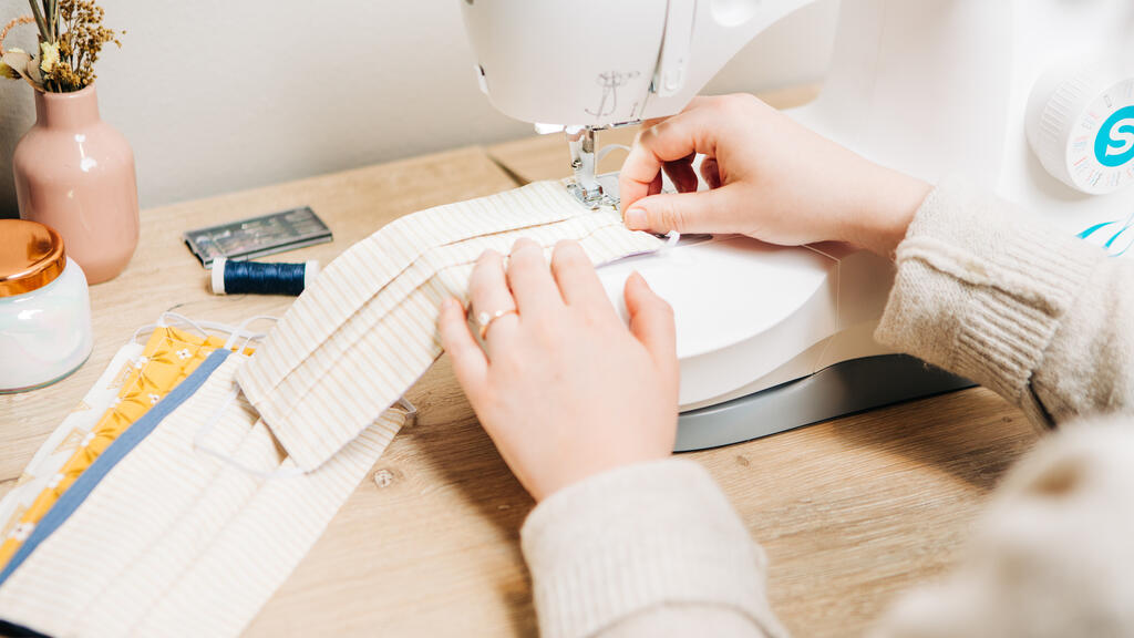 Woman Sewing Face Masks large preview