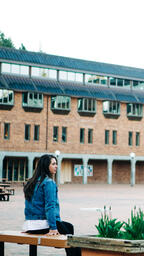 Student Sitting in an Empty College Campus  image 1