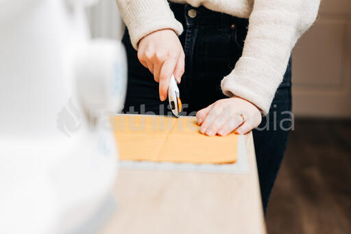Woman Cutting Fabric