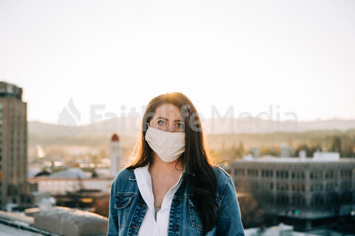 Woman Wearing a Face Mask at Sunrise