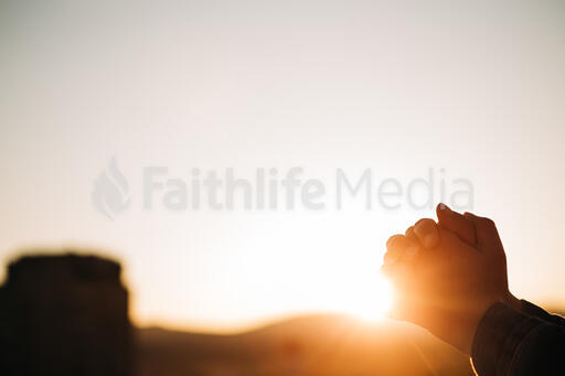 Woman Praying at Sunrise