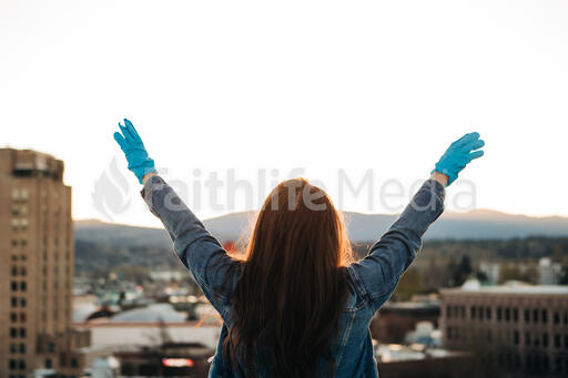 Woman Wearing Medical Gloves and Worshipping