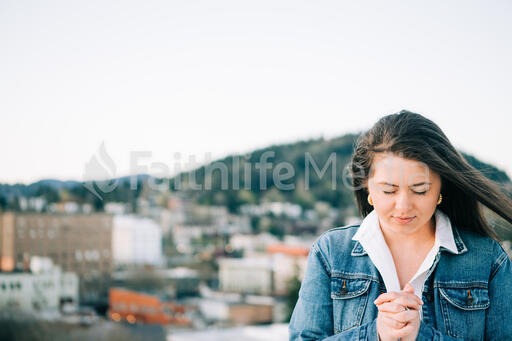 Woman Praying Over the City