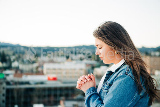 Woman Praying Over the City