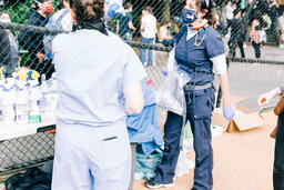 Volunteer Nurse Speaking with a Peaceful Protester  image 2