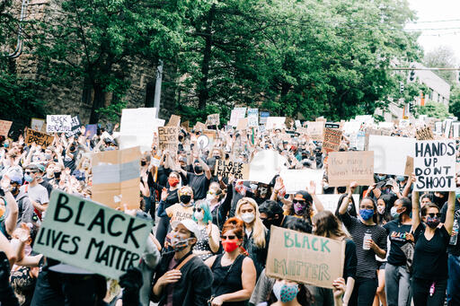 Peaceful Protesters Holding Signs