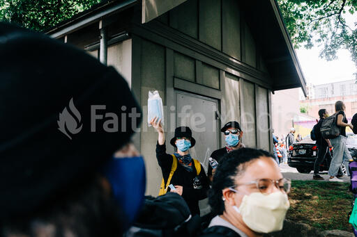 Peaceful Protesters Handing Out Face Masks