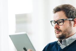 Man Studying on an iPad  image 1