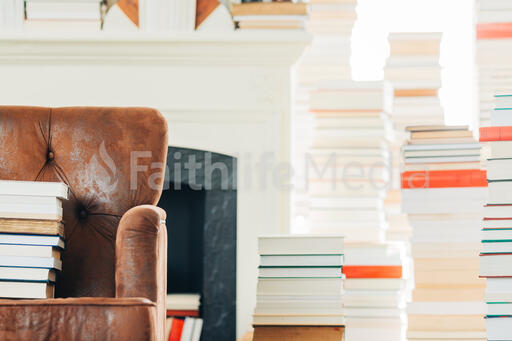 A Stack of Books on a Chair Surrounded by Books