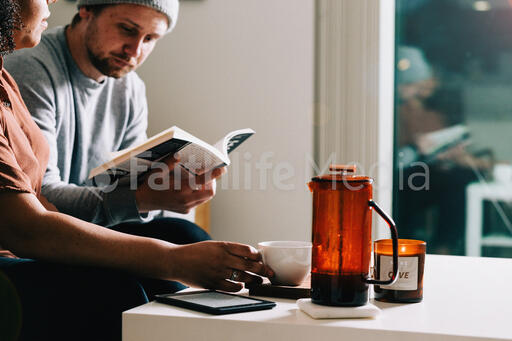 Couple Reading and Drinking Coffee